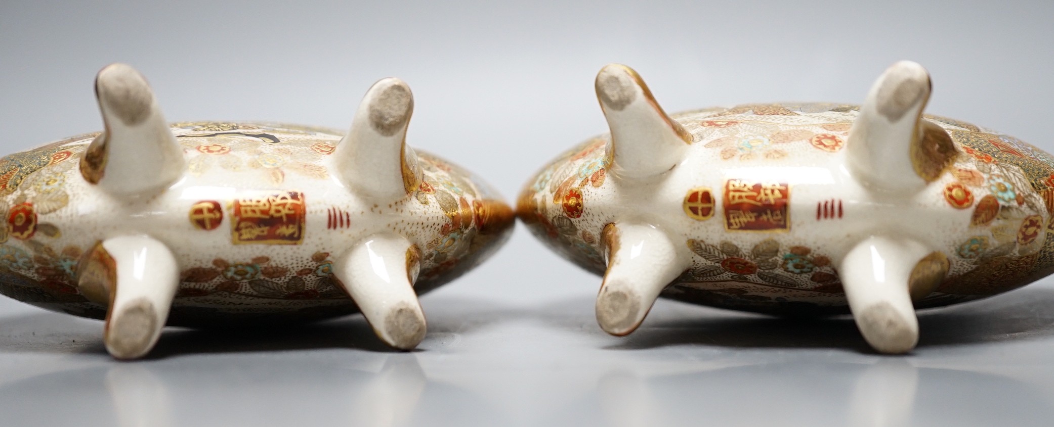 A pair of Japanese Satsuma crescent vases on quad footed base, signed to base, 11.5cm tall